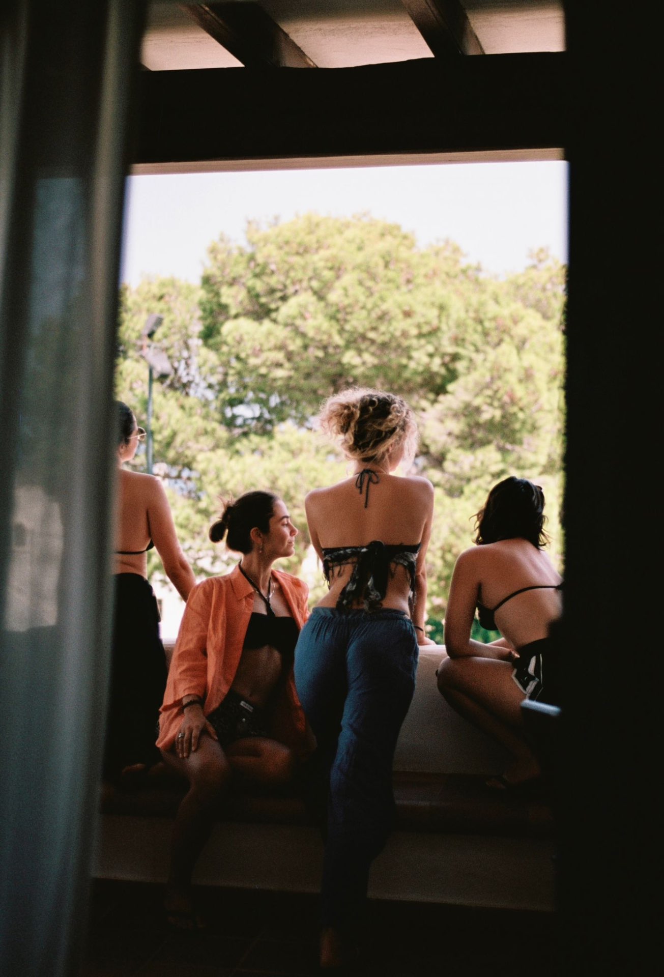 Friends gathered on a sun-drenched terrace